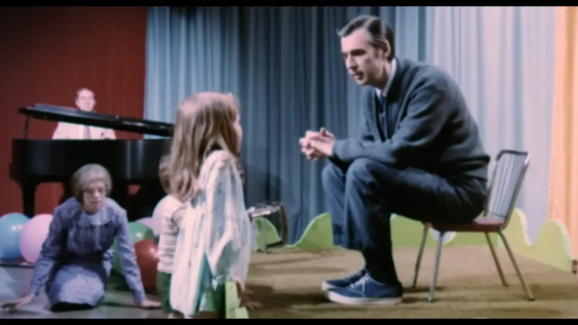mr. rogers talks with a child