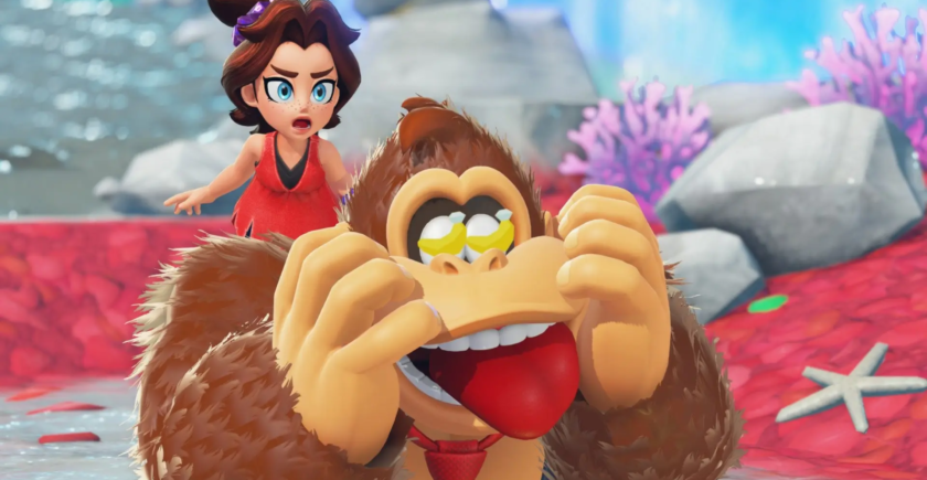 Donkey Kong character in a playful pose with an animated woman in the background on a colorful, vibrant landscape, featuring rocks and coral, highlighting the creativity and fun of the new DK Bananza platformer on Switch 2.